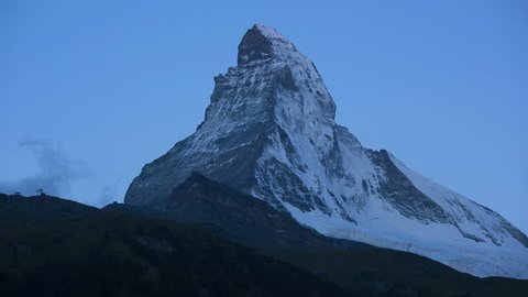 Motion time lapse sunrise dawn shadows majestic Matterhorn summit, Zermatt, Switzerland, Europe