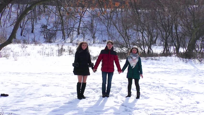 A group of friends are jump up holding hands