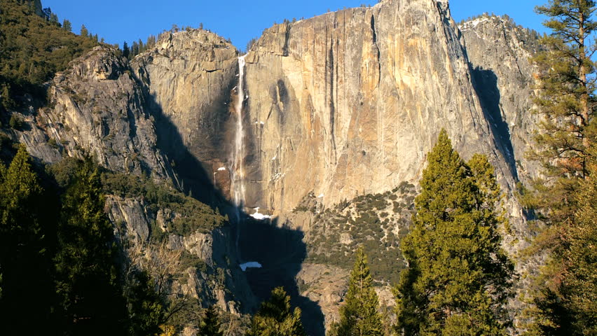 Waterfall pouring down the cliffs in Yosemite National Park, USA