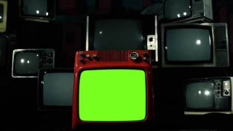 Piled Retro TVs with Flickering Green Chroma Screens. Zoom In. You can replace green screen with the footage or picture you want. You can do it with “Keying” effect in After Effects.