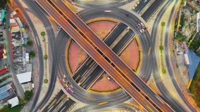 Aerial view of traffic time lapse on intersection circle. Busy traffic at night