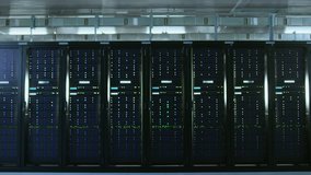 Camera Super Zoom Shot of a Working Data Center With Rows of Rack Servers. Led Lights Blinking and Computers are Working. - Powered by Shutterstock - Get 15% off with code: PIKWIZARD15