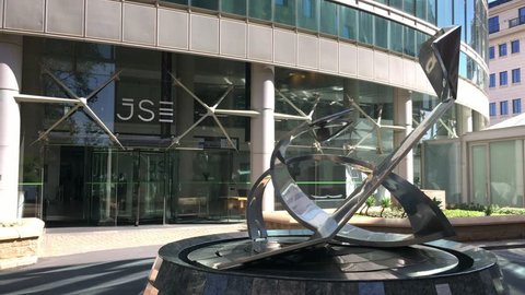Johannesburg, South Africa - 22 January - 2019: Front entrance to stock exchange building with steel sculpture.