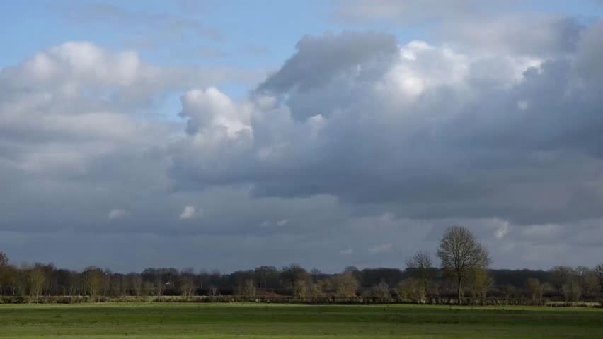 Country landscape and accelerated movement of clouds