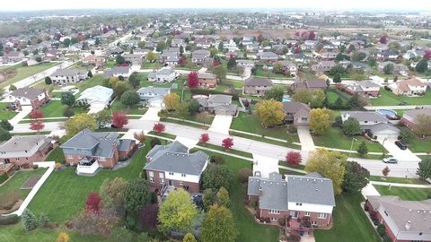 Overhead aerial view of residential houses and yards along suburban street - Travel and leisure concept