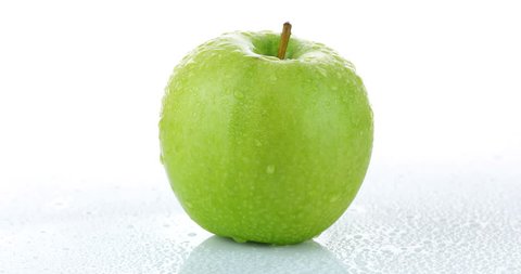 rotating green apple isolated on white background