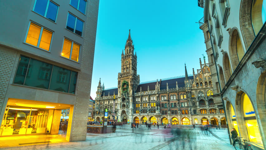 Munich Marienplatz square view of city town hall timelapse hyperlapse video in 4K, germany munchen city centre. Munich Cathedral and church in main square, Bavaria Germany. Munchen night. Royalty-Free Stock Footage #1023235327