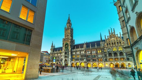 Munich Marienplatz square view of city town hall timelapse hyperlapse video in 4K, germany munchen city centre. Munich Cathedral and church in main square, Bavaria Germany. Munchen night.