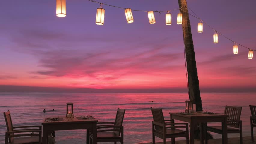 Romantic sunset on the beach on tropical island, Koh Chang, Thailand. Outdoor cafe on the beach. Royalty-Free Stock Footage #1023242665