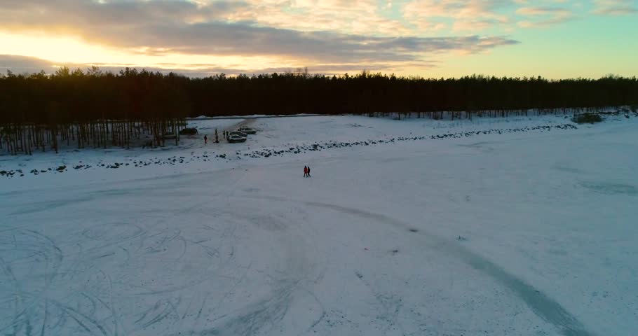 Amazing view on the forest and fields, on a winter evening, aerial shot, 4k