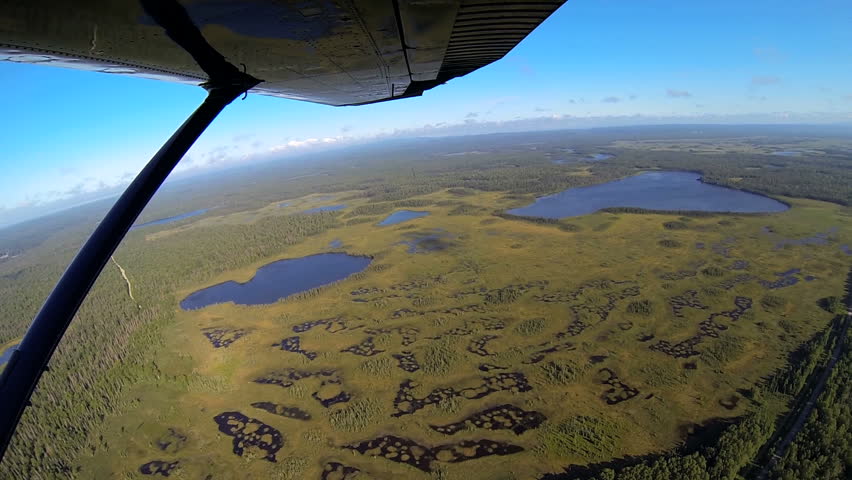 Aerial wide angled view of tundra swampland remote Alaskan Wilderness landscape from light aircraft Northern Hemisphere, Alaska, USA