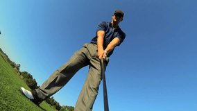 Male Caucasian golf professional luxury golf resort filming selfie as he prepares to tee off