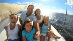 Caucasian parents three children sisters casual living boat luxury yacht vacation social media selfie tourist promotion slow motion