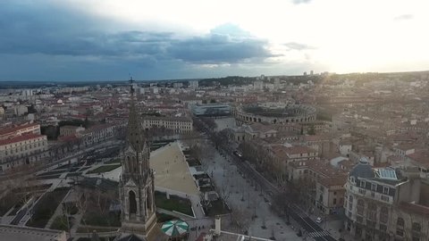 Historical center of Nimes, France. Aerial view of the square, the arena and the tower of the Catholic Church.
