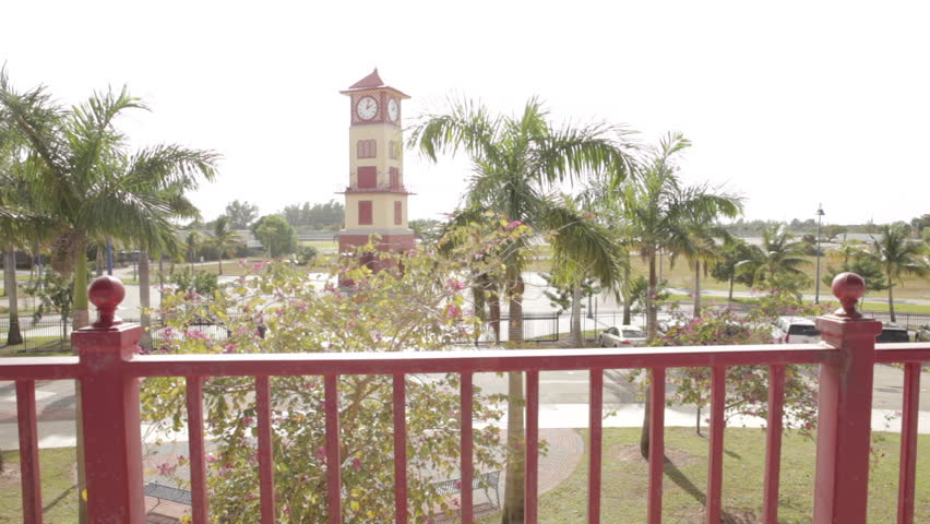 Clock Tower Surrounded by Palm Trees