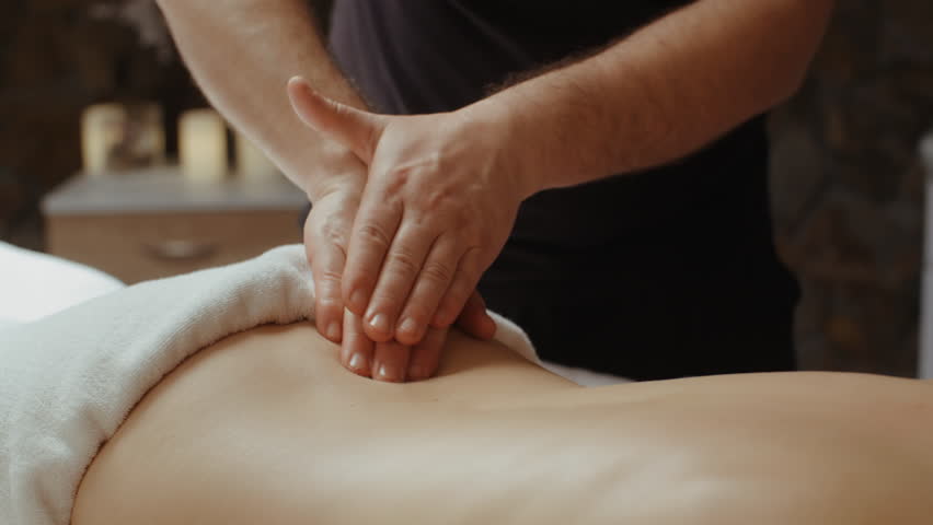 Video Stok two massage therapists give man woman (100% Tanpa Royalti) 10225...