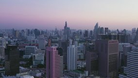 Aerial scene of Fly down over center of bangkok, business center and city building in morning, Thailand, 4k video