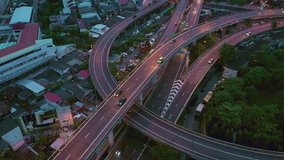 Fly dolly truck movement aerial scene over huge Multiple lane highway with low traffic in urban scene of Bangkok at night, Thailand in 4k videos
