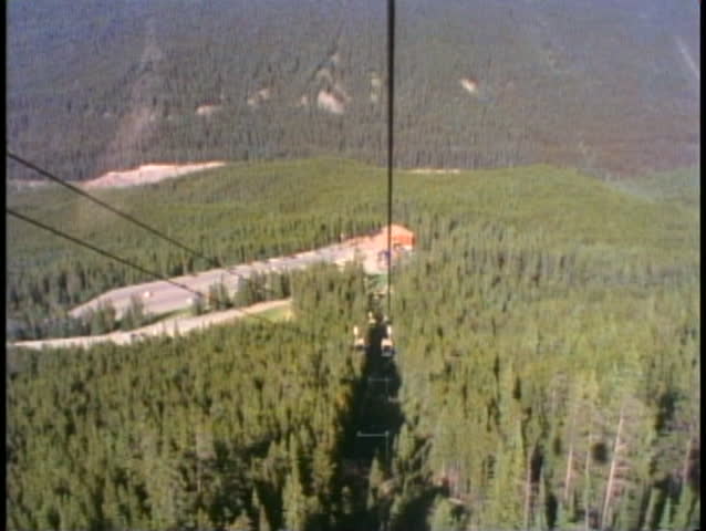 BANFF, ALBERTA, 1990, Gondola ride up Sulphur Mountain, POV, pine trees, firs