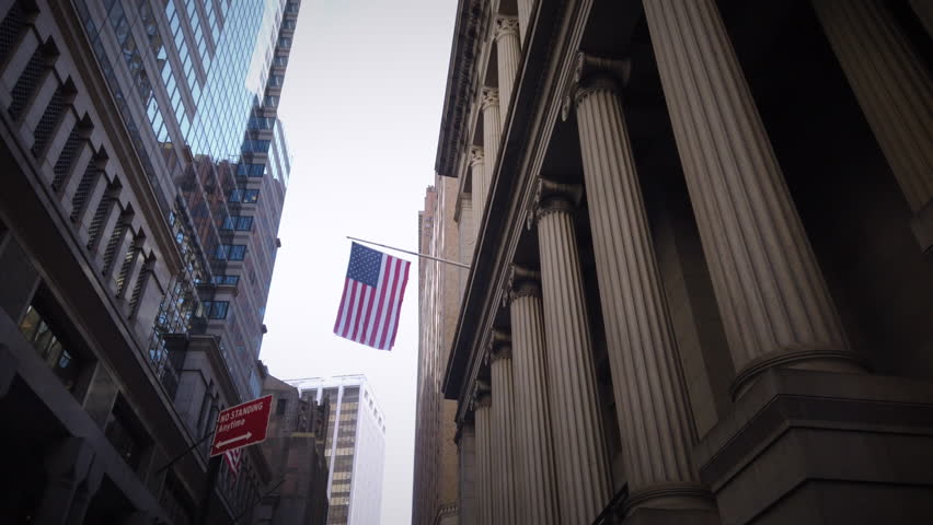 Walking by an American Flag in Wall Street Financial District area in Lower Manhattan New York. Smooth motion shot with a gimbal. | Shutterstock HD Video #1023305407