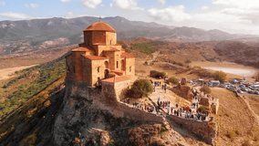 Dramatic. aerial perspective of Jvari Orthodox Monastery. a sixth century landmark on a remote mountain top in eastern Georgia. 4k Ultra HD video