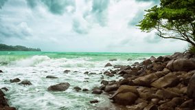 Rocky deserted shore of the tropical sea on a cloudy day. 4k stock footage