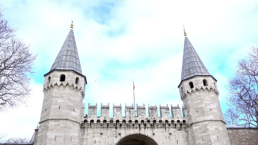 Entrance to the palace of the Sultan. Gates with towers and flag. Istanbul, Turkey.