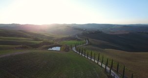 Amazing Italy aerial landscape, typical tuscany aerial landscape. Aerial video over amazing Tuscany landscape, with winding road with cypresses. 
