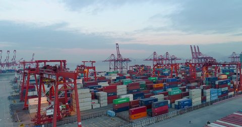 aerial view of the container port in Shenzhen China in the evening. 4k drone footage of global trade and logistics.