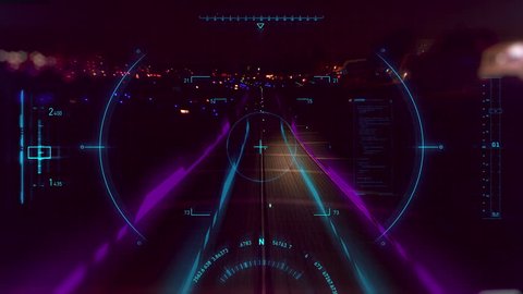 2D animated HUD elements used as navigation as airplane is landing at airport at night. Footage shot on 4k RED camera.
