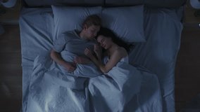 Happy Young Couple Cuddling Together in the Bed Sleeping at Night. Beautiful Girl and Handsome Boy Sleeping Together, Sweetly Embracing Each other. Top Down Shot - Powered by Shutterstock - Get 15% off with code: PIKWIZARD15
