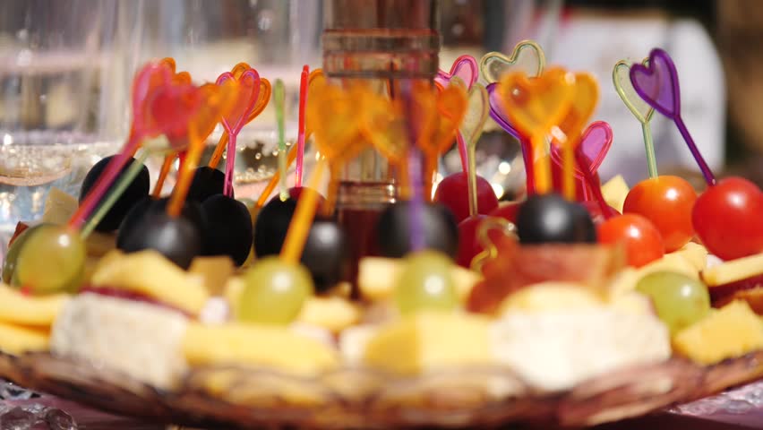 eautifully decorated Banquet table with a variety of fruits and canapes for a family celebration.