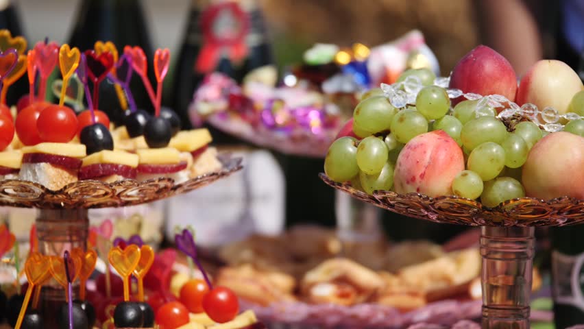 eautifully decorated Banquet table with a variety of fruits and canapes for a family celebration.