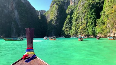 Beautiful panorama of turquoise water and rocks, tropical Phi Phi Islands view from traditional Thai long boat, Krabi province Thailand