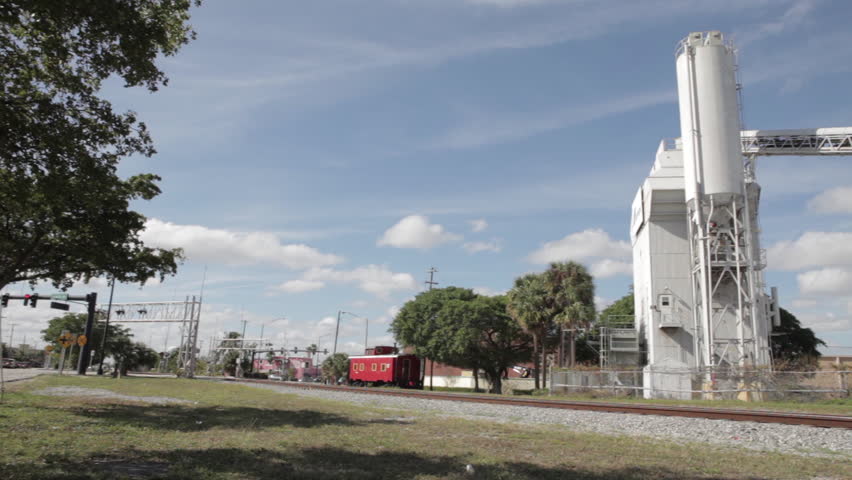 Old Red Train Cart Beside Tracks