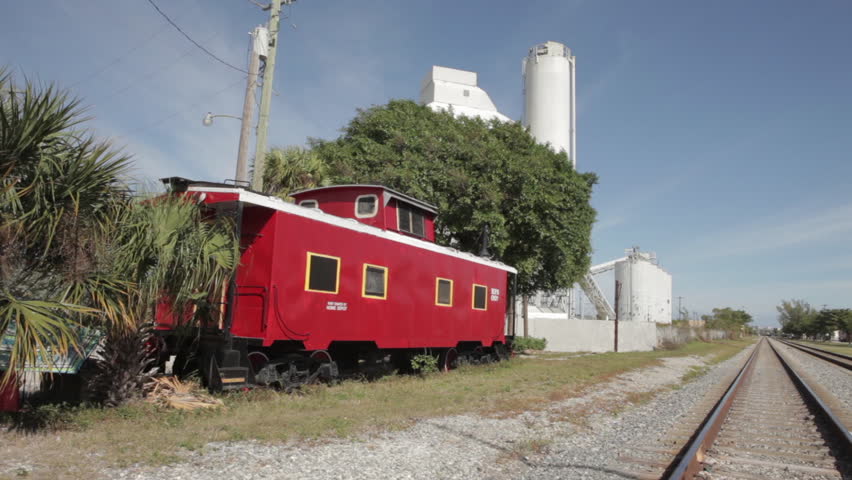 Old Red Train Cart Beside Tracks