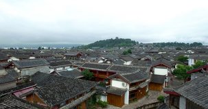 Amazing aerial video of traditional asian town. Aerial view of asian ancient town.
Flying over the rooftops of asian old town.