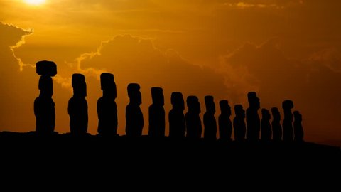 Moai, the Ancient and Mysterious Sculpture at Sunset, Time Lapse with Red Sun and Clouds, Easter island, Polynesia, Chile