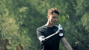 Prosthetic hand holding a bottle. Human with a robot arm. - Powered by Shutterstock - Get 15% off with code: PIKWIZARD15