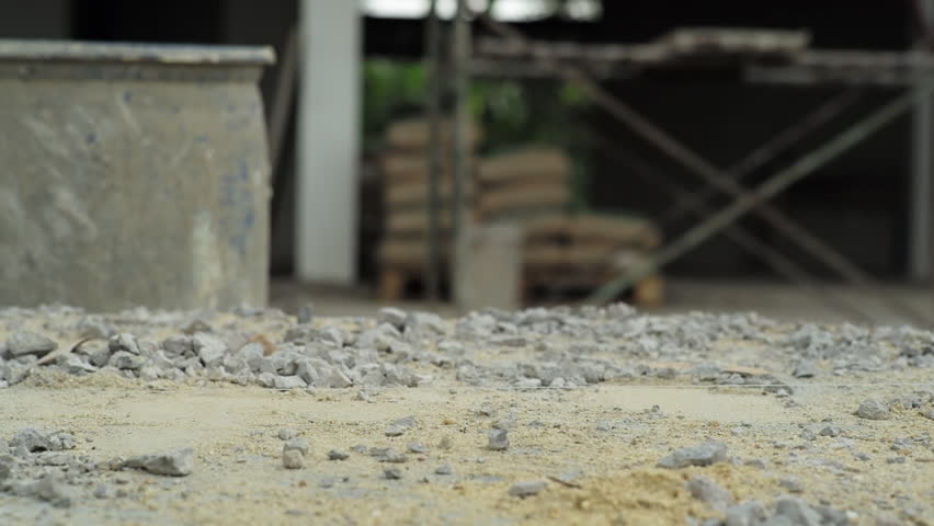 Shopping cart carries the crushed stones at the construction site. 