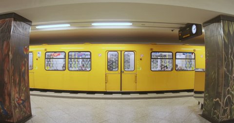 Berlin, Germany - 20 July, 2018: Doors of train closing. Underground station interior. Indoors, yellow line. Modern city, public transport, metro, speed, vehicle. Germany Berlin