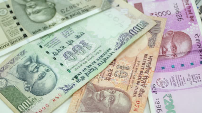 India money and US dollar on the rotating table. 4K