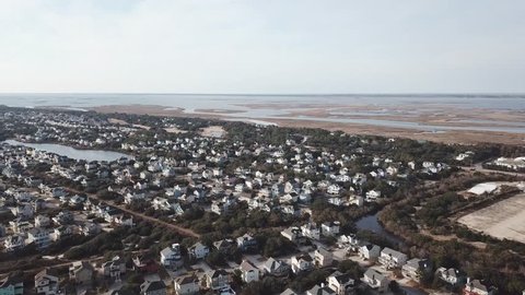Aerial drone shutting video with beach and houses from Corolla North Carolina 