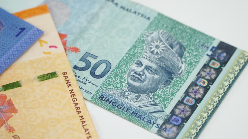 Malaysia money on rotating table. 4K | Shutterstock HD Video #1023400402