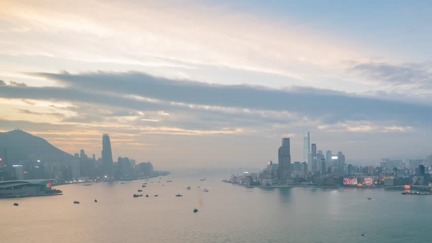 Sunset timelapse of the famous Victoria Harbor at Hong Kong