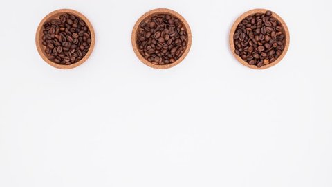 Stop motion footage of coffee beans in shape of cup, hart and bean. Coffee love concept.