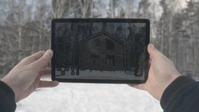 Man is making architecture photography with tablet in winter, home and building concept. Stock. Hands men take photos at home - Powered by Shutterstock - Get 15% off with code: PIKWIZARD15