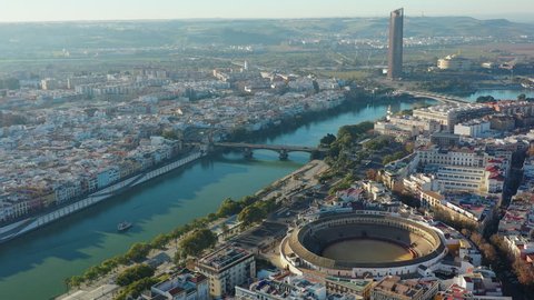 Aerial view of Seville, famous European historic city and capital of Andalusia, corrida bullring (bullfighting arena) Plaza de toros de la Real Maestranza de Caballeria de Sevilla - Spain, Europe