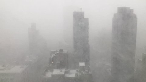 Snow squall (snowstorm) whipping through the skyscrapers in Manhattan, New York City
