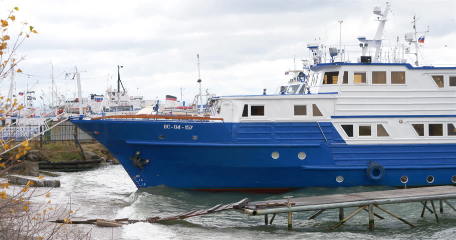 Clean transparent water wave surfing on the shore and ship